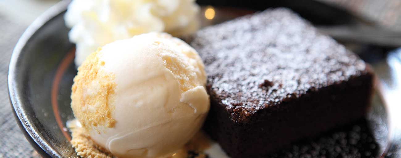 brownie with scoop of vanilla gelato