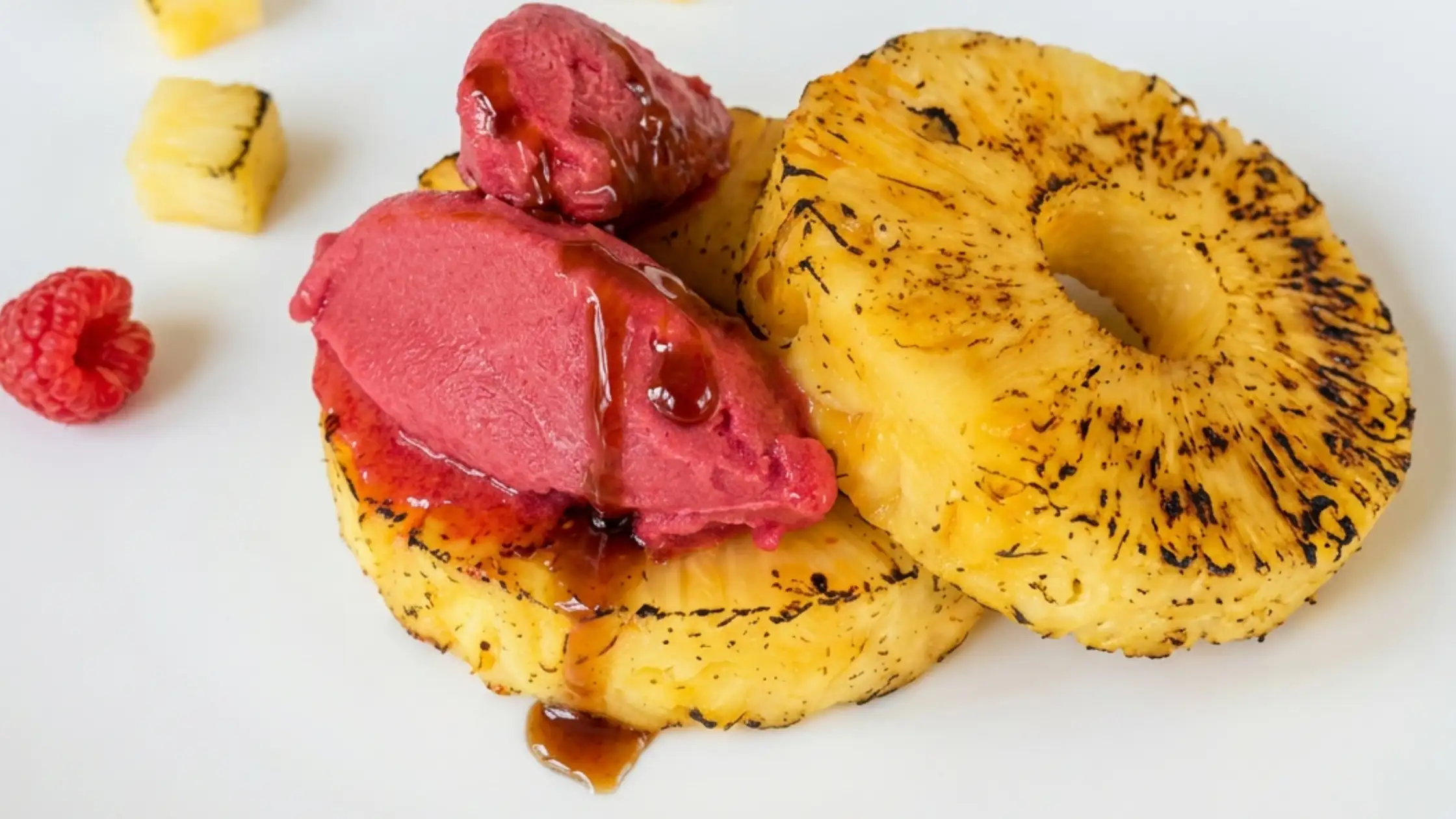 fire roasted pineapple with raspberry sorbetto, tajin, and hot honey