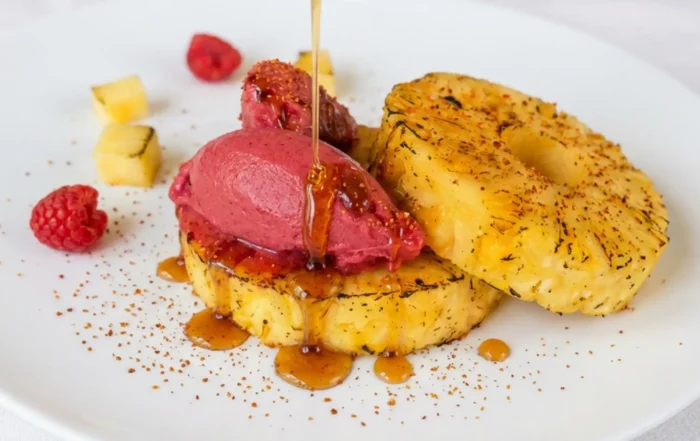 fire roasted pineapple with raspberry sorbetto, tajin, and hot honey