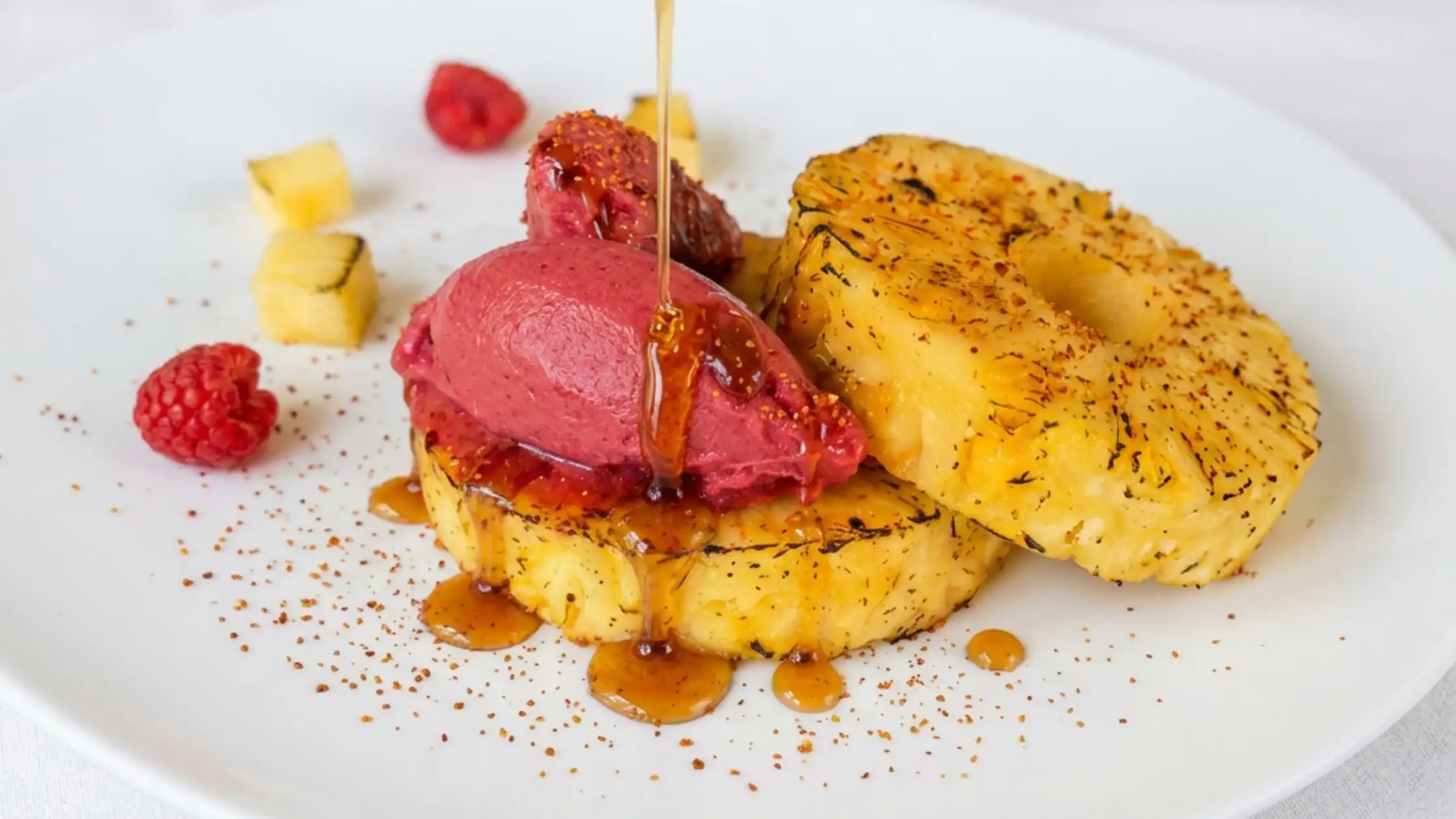 fire roasted pineapple with raspberry sorbetto, tajin, and hot honey